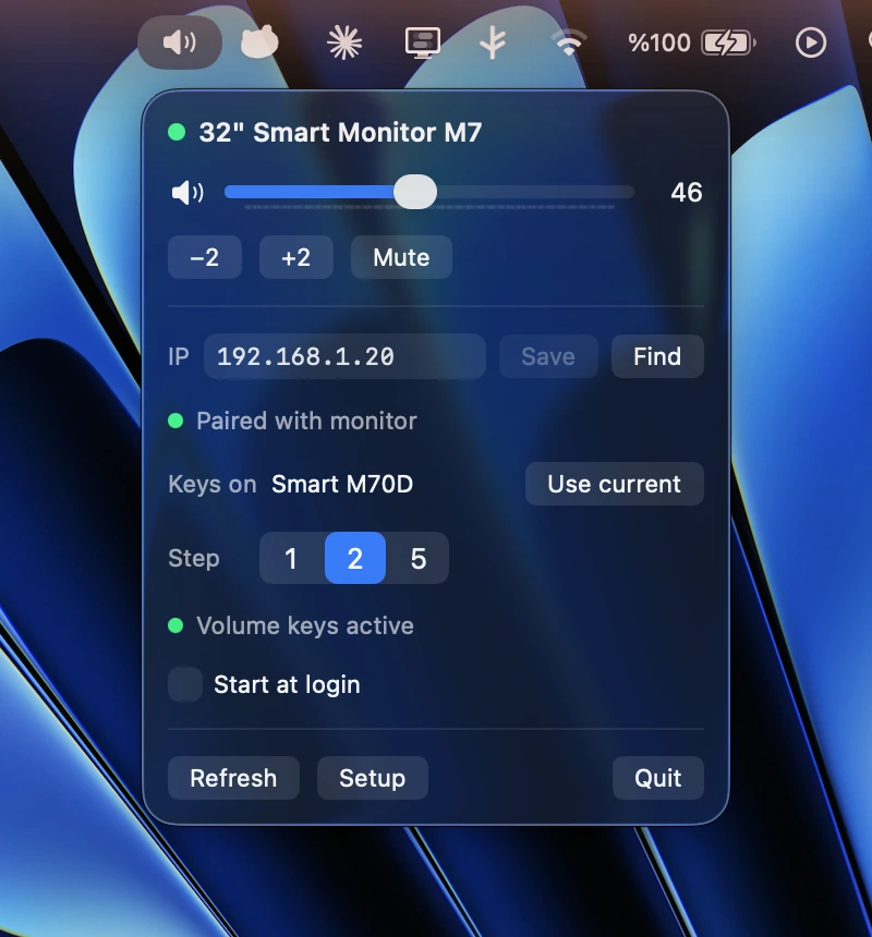 The SmartVolume panel open beneath its menu bar icon, showing the connected 32 inch Smart Monitor M7, a volume slider at 46, minus two and plus two step buttons, a mute button, the monitor's IP address, a paired status light, a 1 / 2 / 5 step picker and a start at login toggle